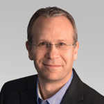 A headshot of Brett Magun, J.D.