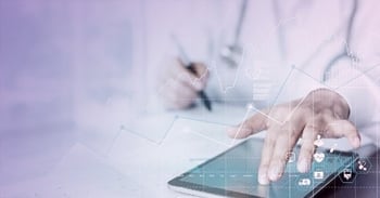 Doctor taking notes with a tablet