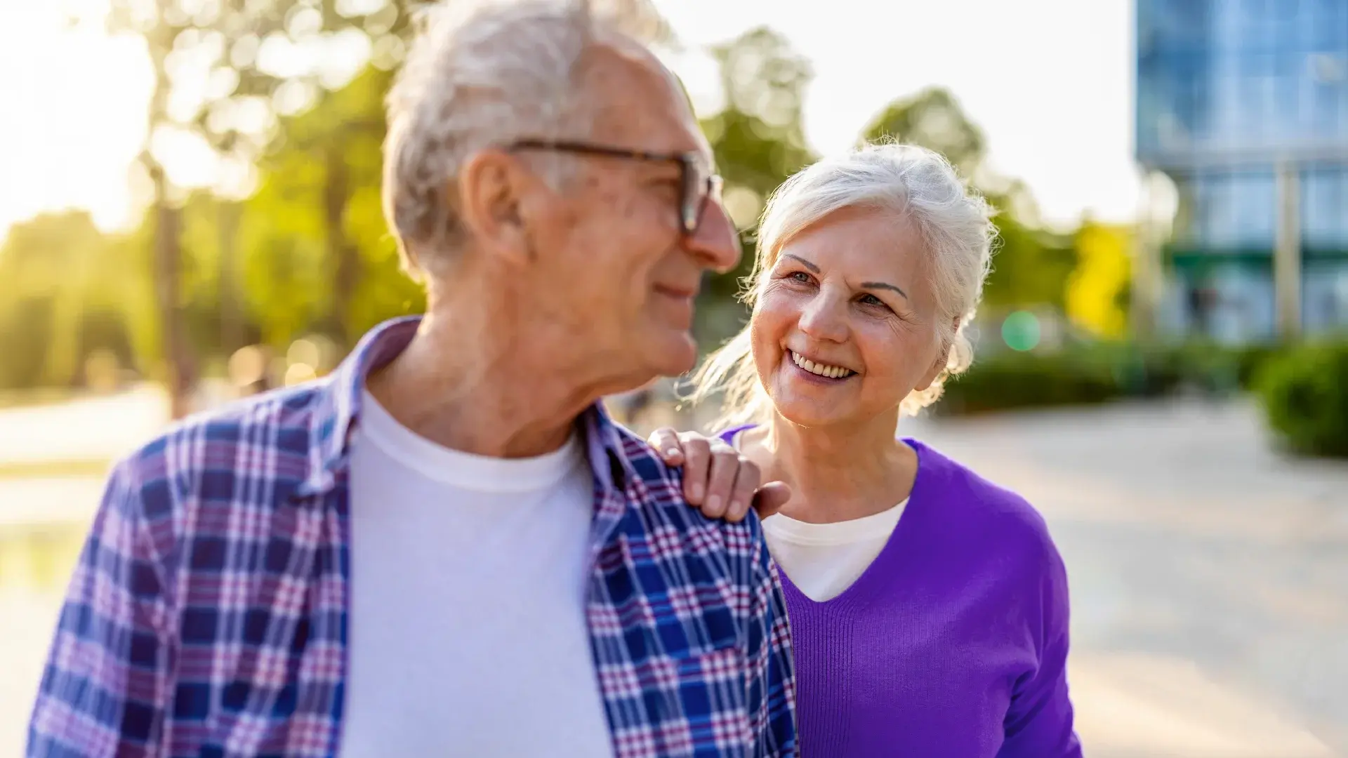 An elderly couple smiling