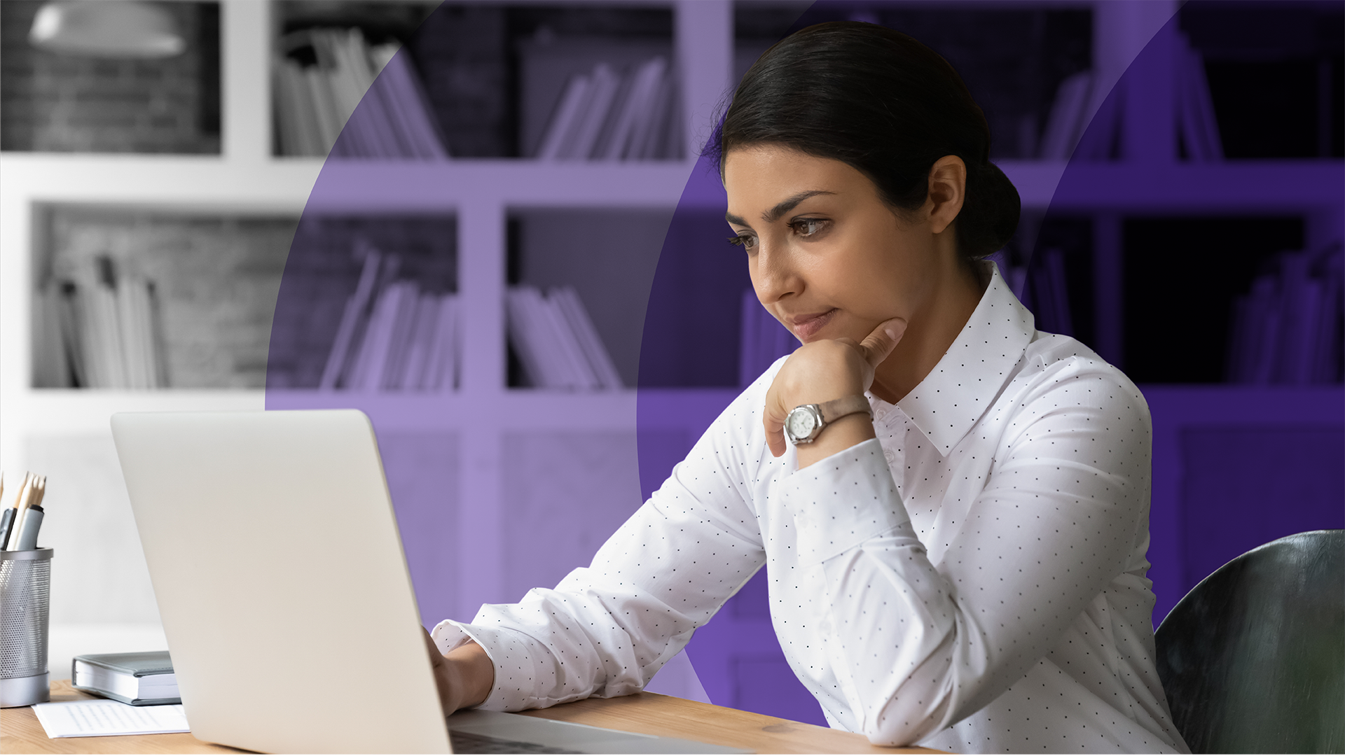 A woman working on a laptop